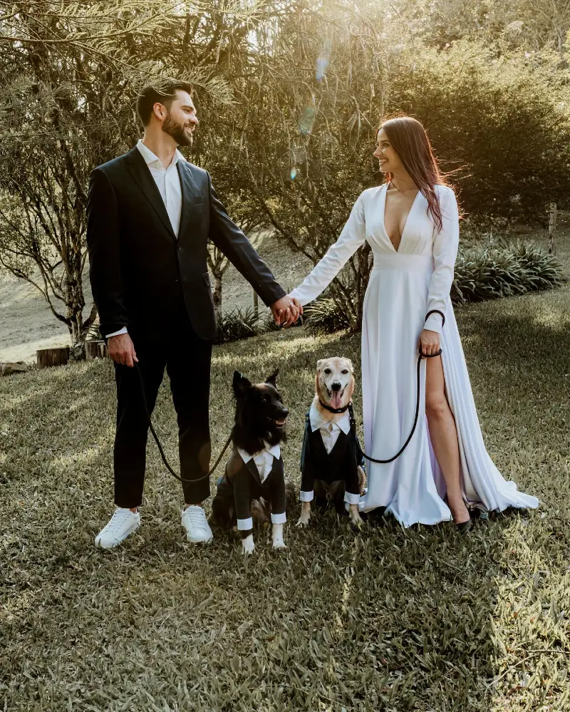 16. Black Tie Couple Look with Two Dogs in Mini Tuxedos