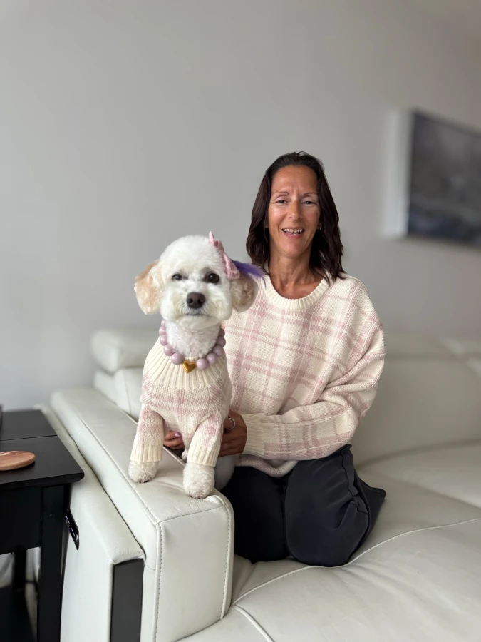 20. Cream and Pink Plaid Knit Sweaters on a White Poodle