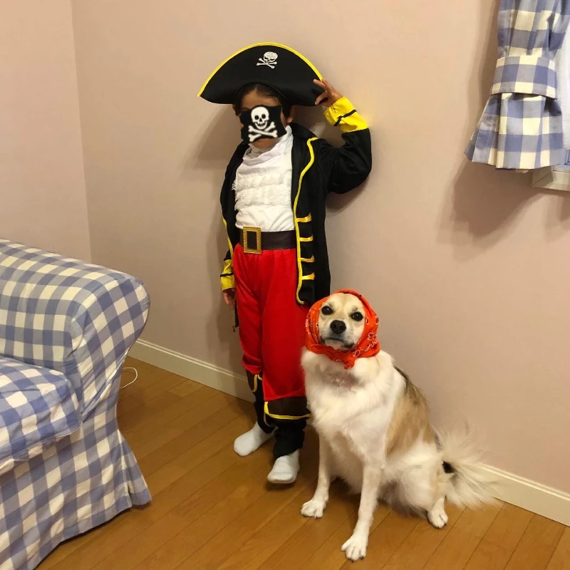 5. Pirate Captain Kid with Skull Hat and Bandana Dog Duo Costume at Home