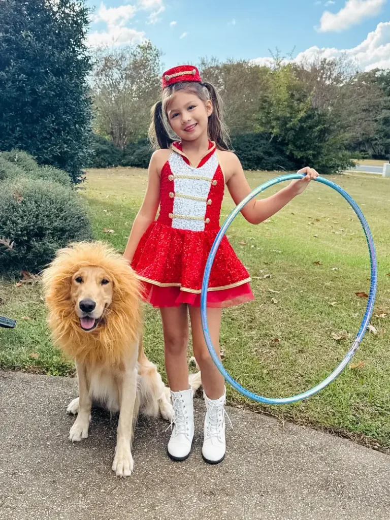 6. Circus Ring Leader Dress with Lion Maned Golden Retriever Outdoors in the Park