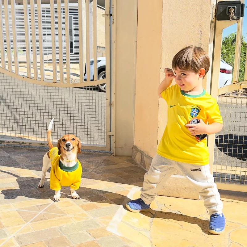 9. Matching Brazil-Inspired Sports Jersey Duo with Kid and Dog in Sunny Outdoor Driveway