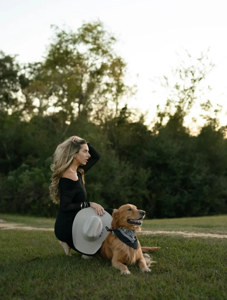 Black Paisley Bandana on a Golden Retriever Beside His Owner