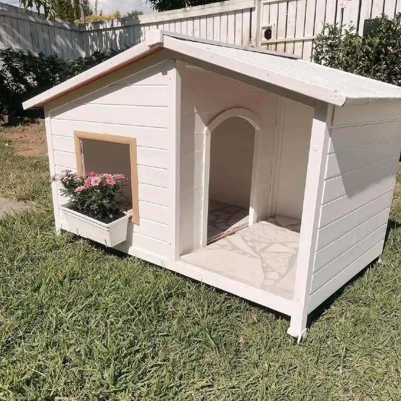 Coastal White Shiplap Kennel with Arched Doorway, Flagstone Flooring, and Window Planter Box