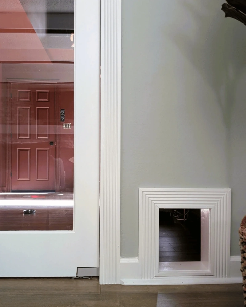 Fluted White Molding Pet Pass-Through Set in Sage Green Drywall