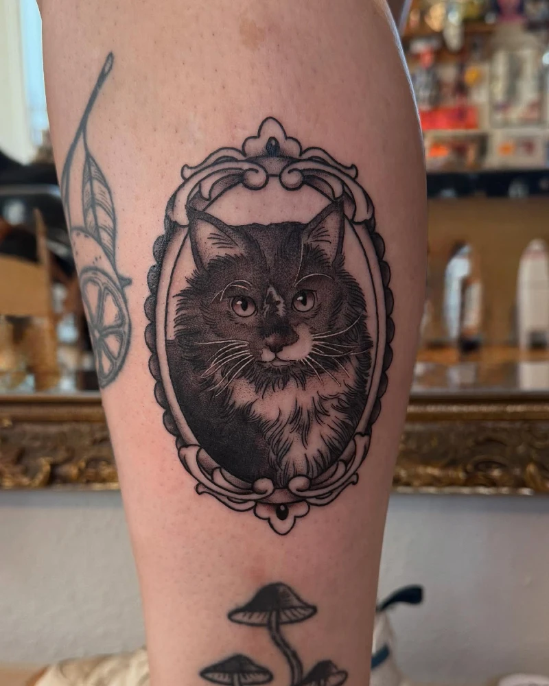 Long-Haired Cat Portrait in an Ornate Vintage Frame Tattoo