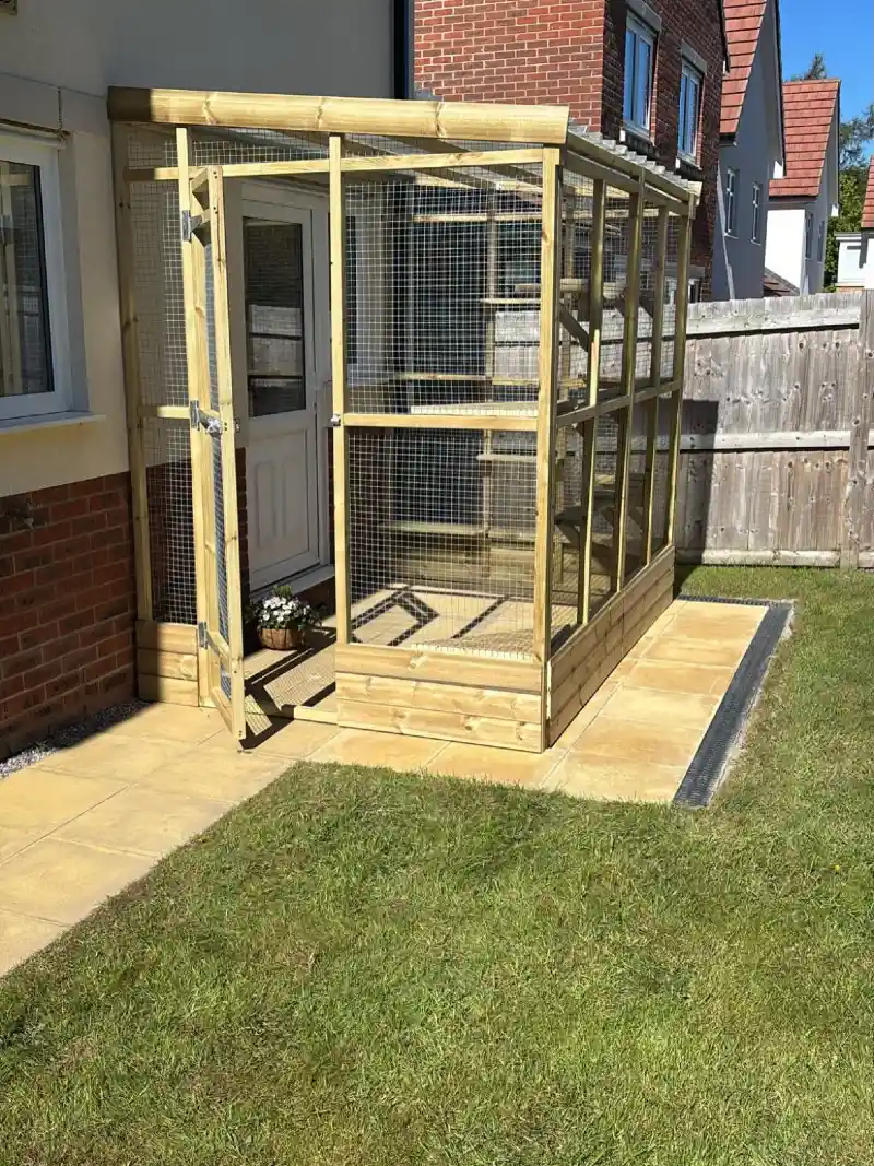 Natural Pine Doorway Enclosure with Corrugated Roof on Tan Pavers