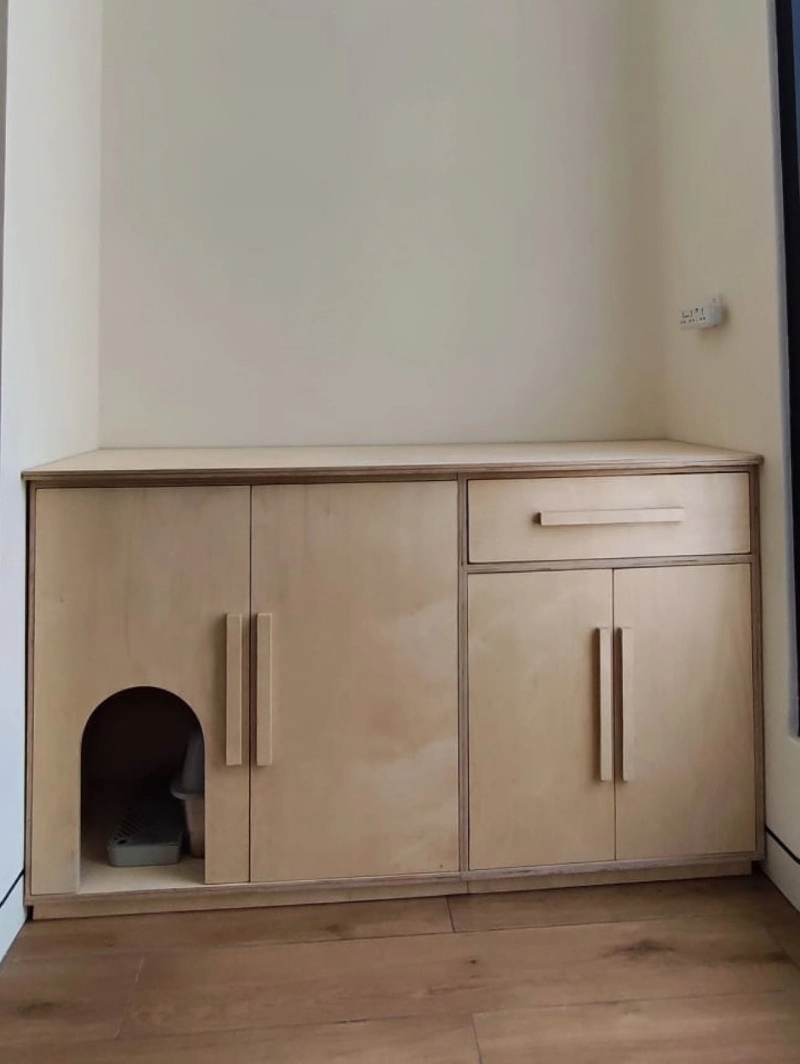 Pale Birch Plywood Built-In Credenza with Arched Pet Entryway and Integrated Storage