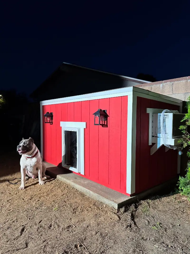 Red Board-and-Batten Barn Cabin with Side Air Conditioner