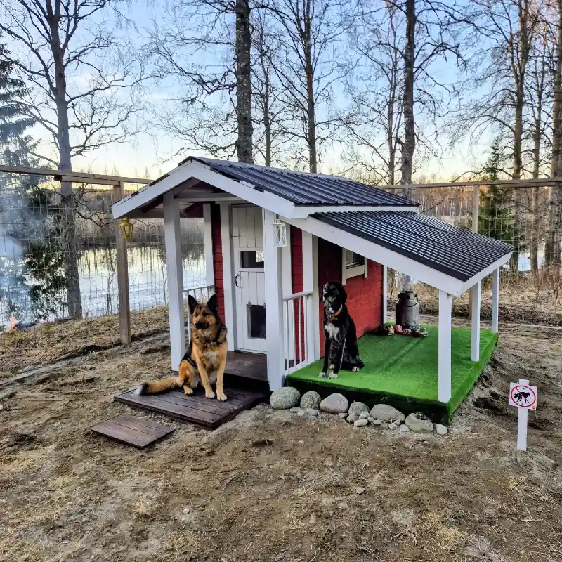 Scandinavian Red Cottage with Standing Seam Roof, Integrated Doggy Door, and Turf Veranda