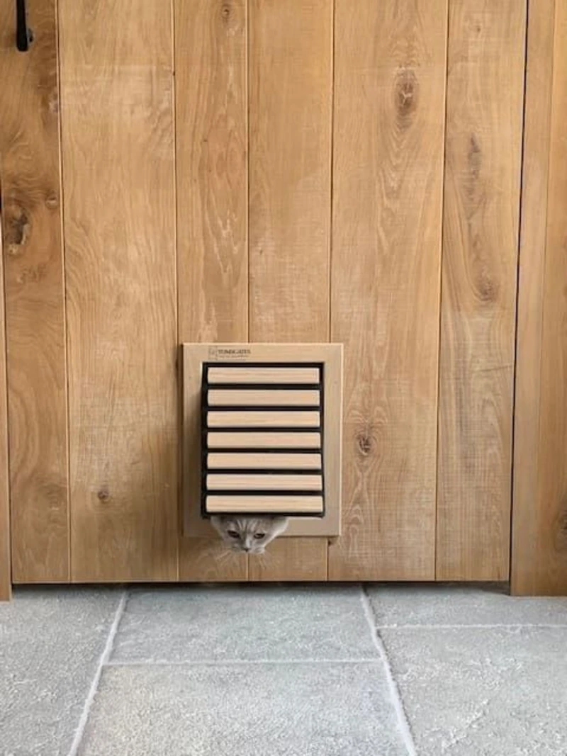 Slatted Wood Flap Inset in Natural Vertical Timber Plank Wall