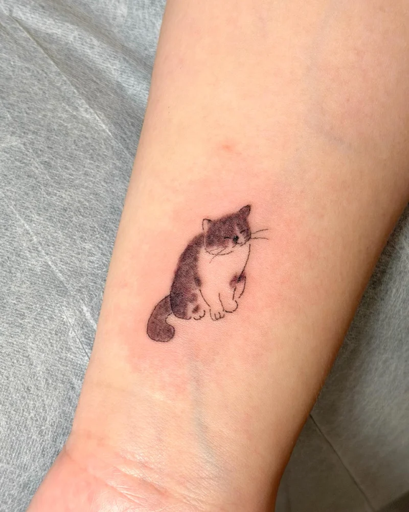 Soft Watercolor Bi-Color Cat Tattoo on the Inner Wrist