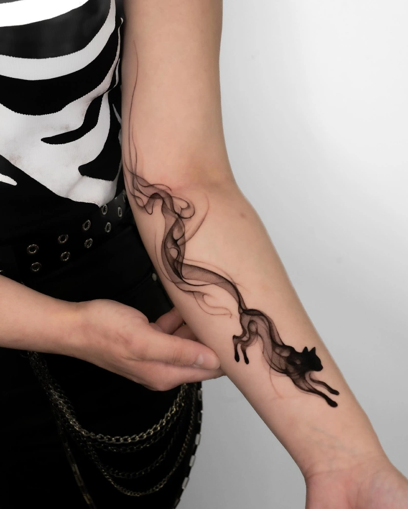 Surrealist Smoke-Trail Running Black Cat Tattoo on the Forearm