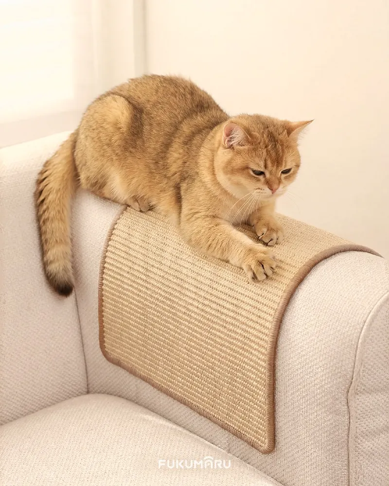 Beige Sisal Scratching Guard Draped over Cream Fabric Sofa Armrest