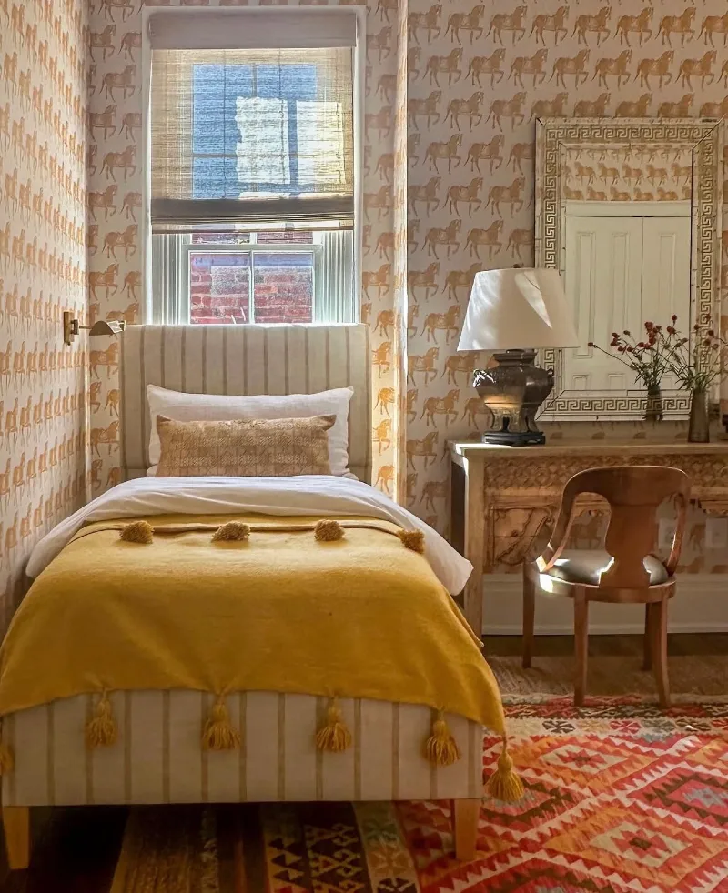 Block-Printed Horse Wallpaper with Striped Daybed and Mustard Tassel Blanket