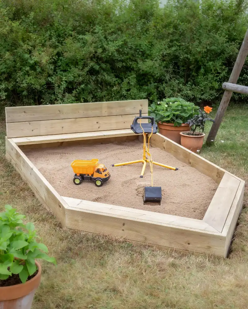 Boat-Shaped Timber Sandbox with Built-In Bench and Toy Excavator
