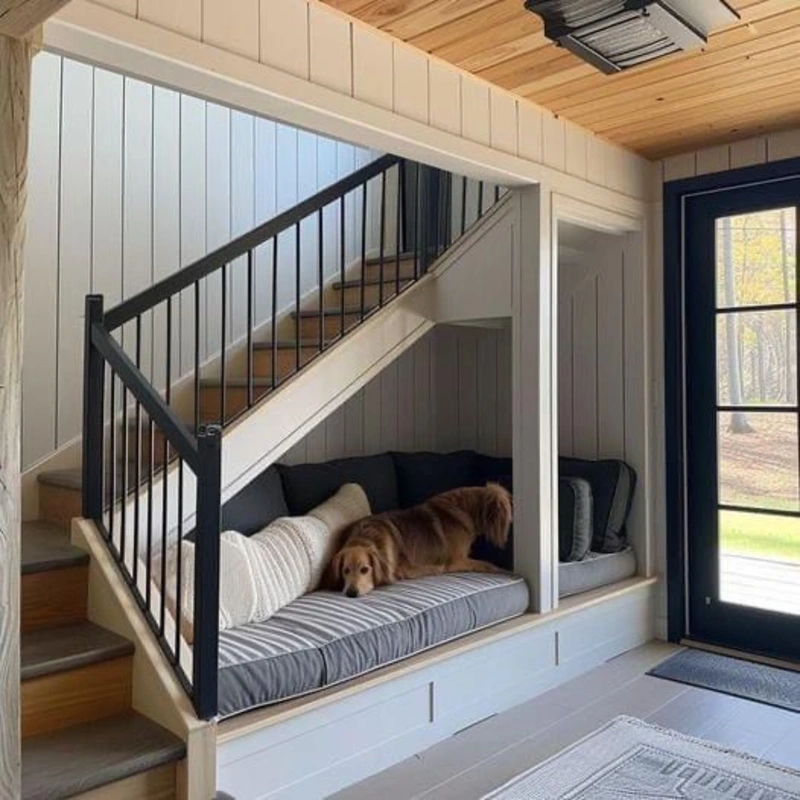Built-In Cream Shiplap Daybed with Striped Cushions and Black Railing Accent