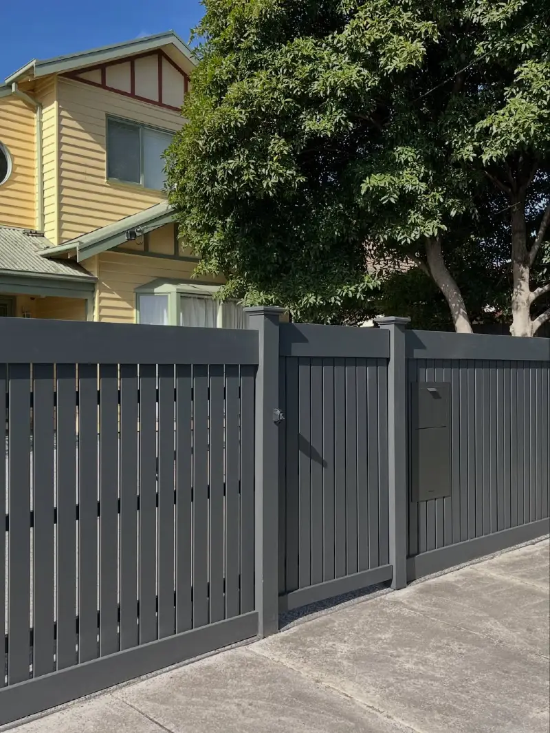 Charcoal Grey Slatted Timber Boundary Wall with Integrated Gate