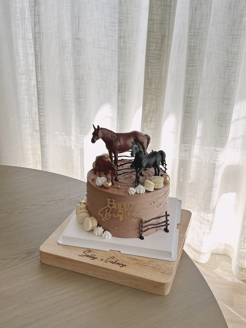 Chocolate Ring Cake with Trio of Horse Figurines and Delicate Meringue Kisses