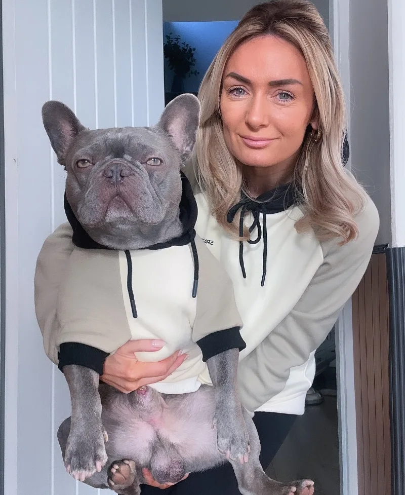 Color-Blocked Neutral Hoodies on a Woman and Her Blue French Bulldog
