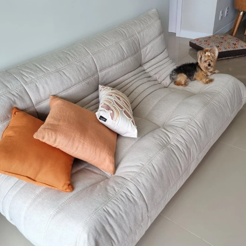 Cream Channel-Tufted Floor Sofa with Terracotta Linen Pillows