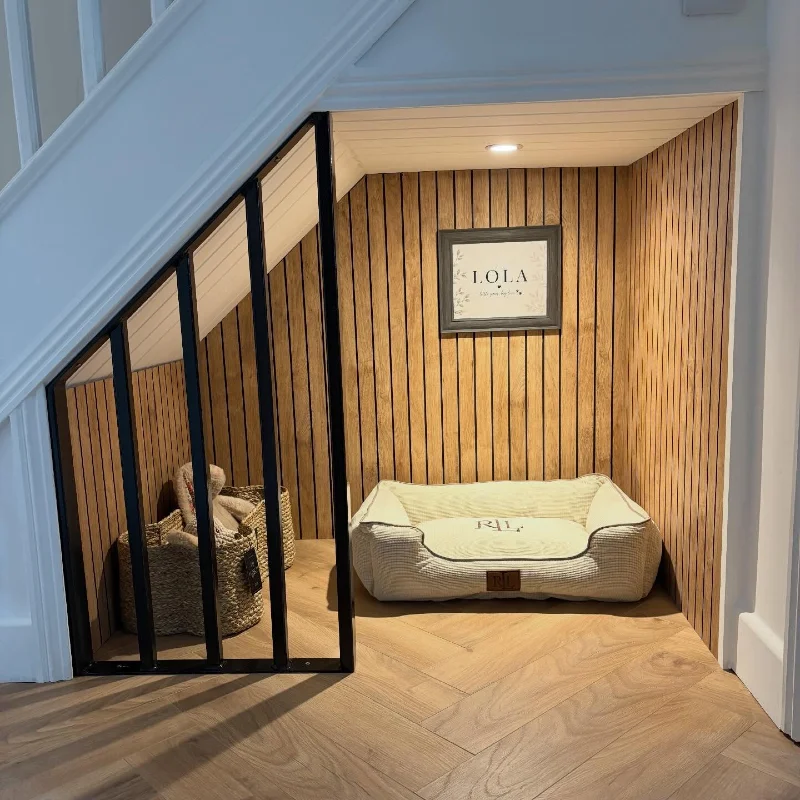 Custom Slatted Wood Alcove with Cream Bolster Bed and Woven Toy Baskets