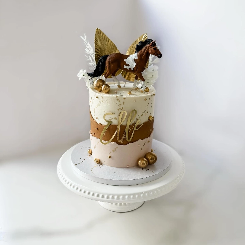 Earth-Toned Fault-Line Cake with Gold Palm Spears and Pinto Topper