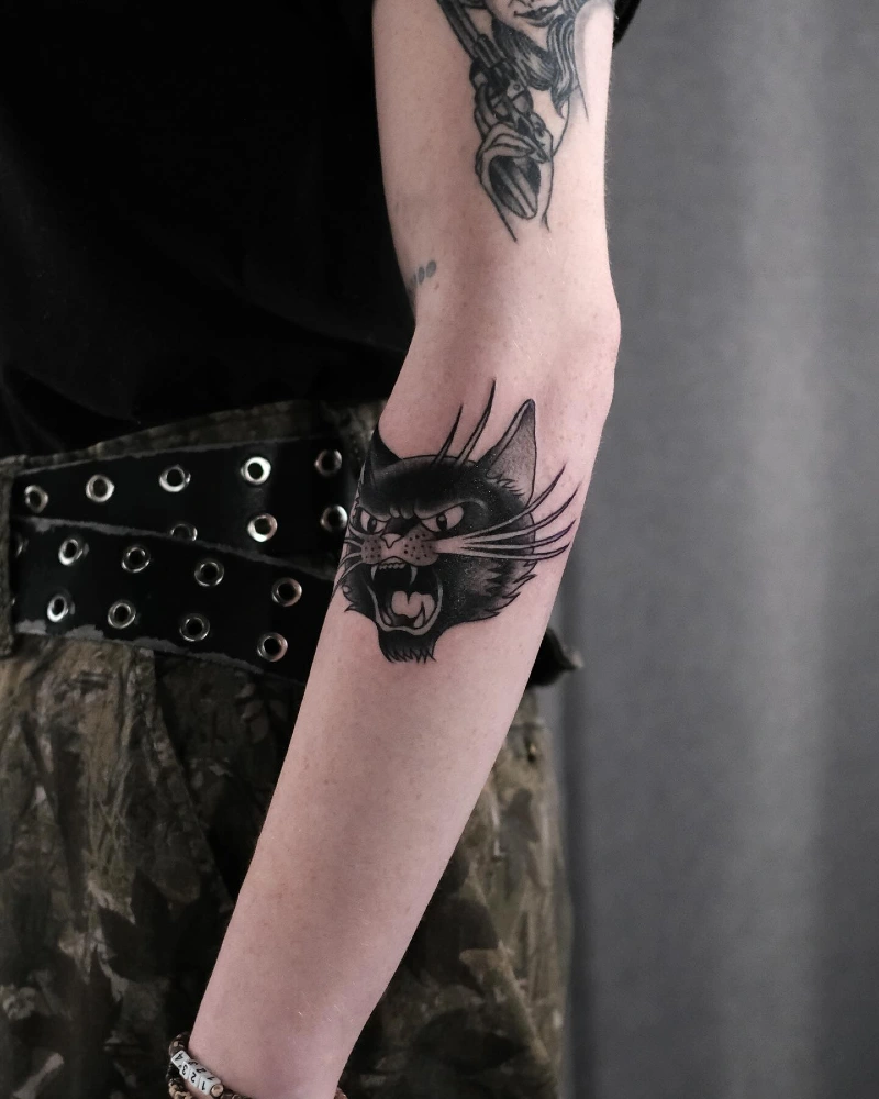 Edgy Hissing Feline Portrait on the Back of the Arm