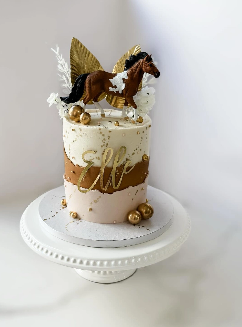 Elegant Earth-Toned Tier with a Miniature Paint Horse Topper