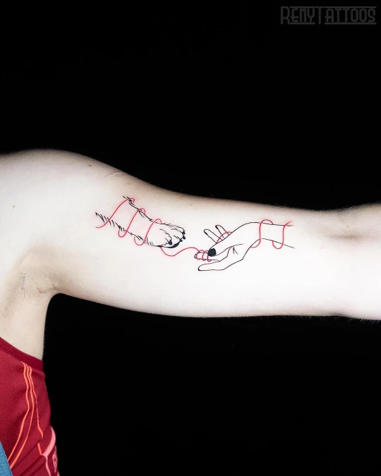 Fine Line Human Hand And Dog Paw With Red Thread