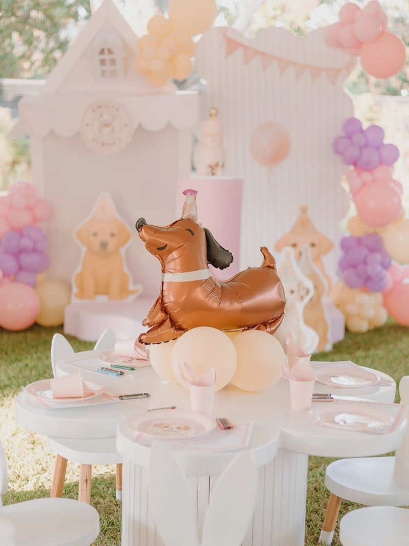 Flower-Shaped Picnic Table with Dachshund Balloon Centerpiece and Pastel Backdrop Panels