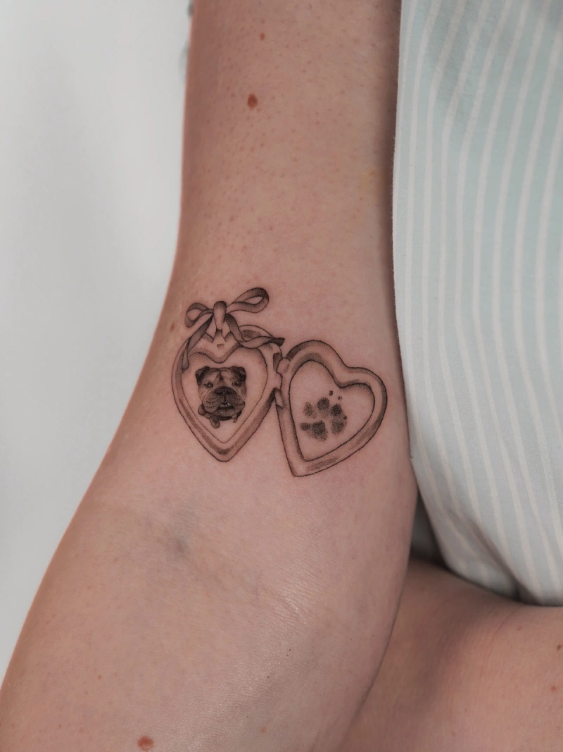 Heart locket with a dog portrait and paw impression