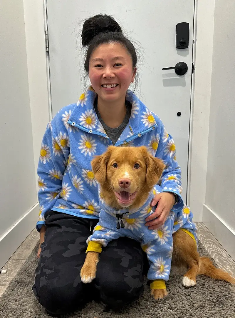 Light Blue Daisy Print Fleece Pullovers on a Woman and Her Nova Scotia Duck Tolling Retriever