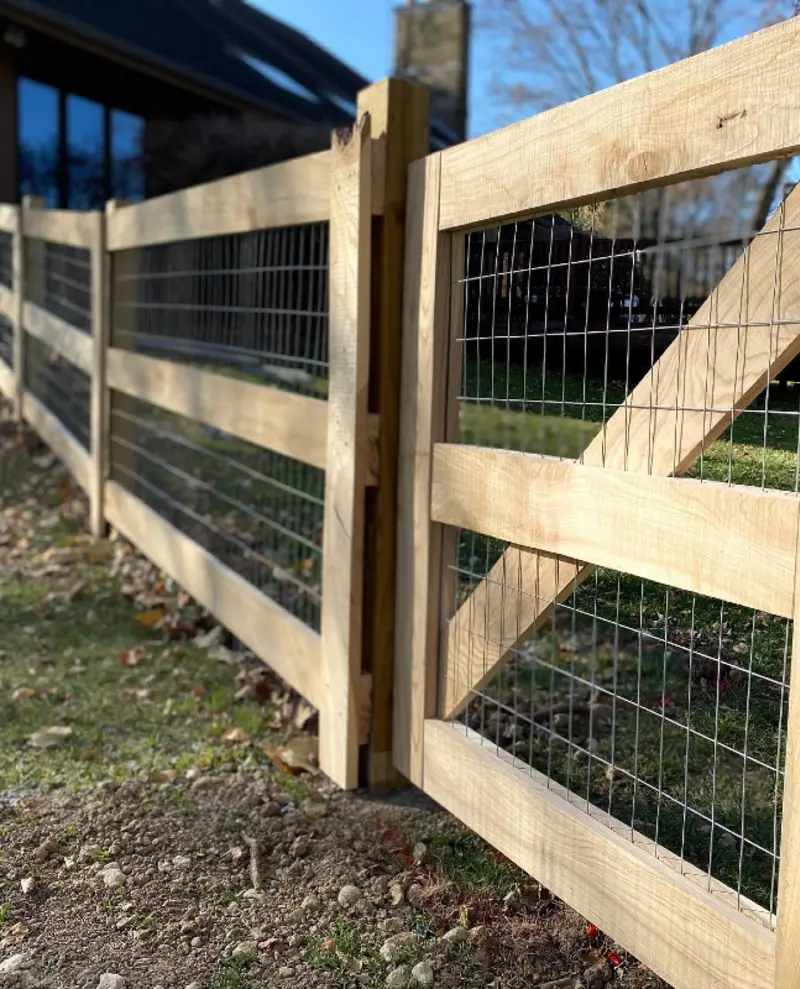 Light Timber Split-Rail Gate with Welded Wire Infill over Rocky Ground