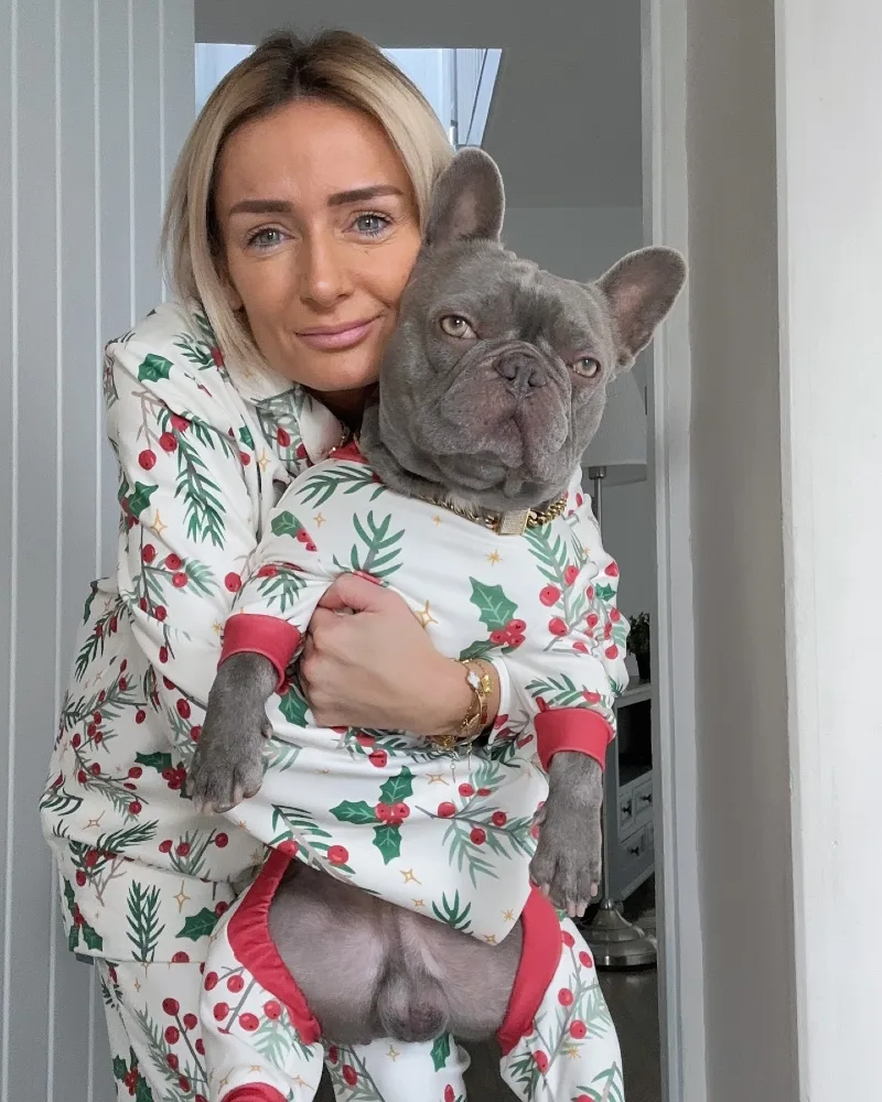 Matching Holly Berry Loungewear Sets on a Woman and Her Blue French Bulldog