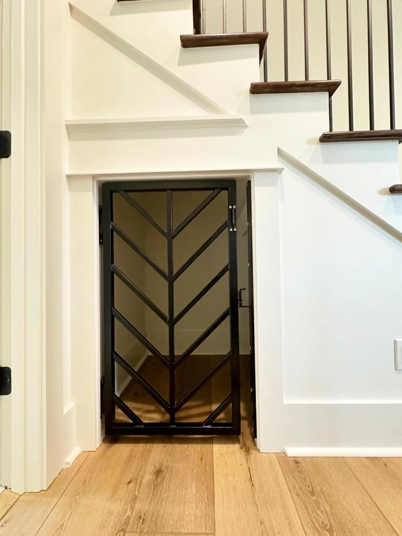 Modern Chevron Iron Gate with Architectural Under-Stairs Trim
