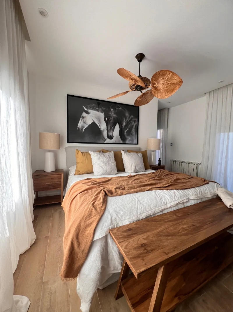 Monochrome Horse Photography with Mustard Bedding and Woven Leaf Ceiling Fan