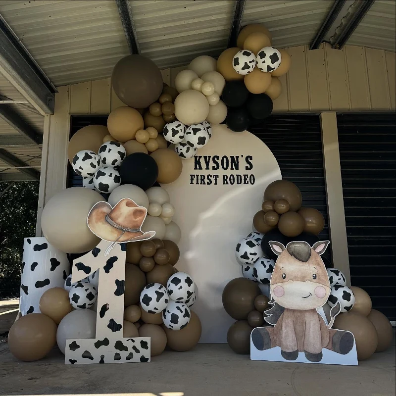 Monochrome Rodeo Backdrop with Cow-Print Balloons and Illustrated Horse Cutout
