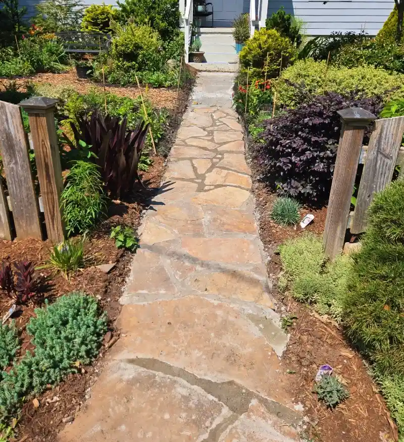 Mortared Flagstone Walkway with Wood Post Boundaries and Layered Non-Toxic Garden Borders