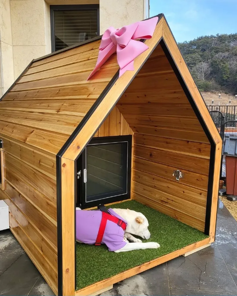 Natural Pine A-Frame Shelter with Green Turf Interior and Pink Bow Accent