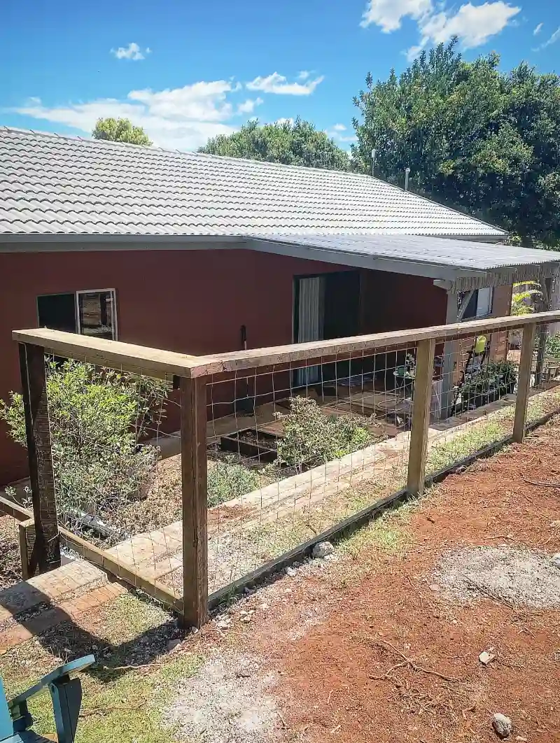 Natural Wood Post Split-Rail Fence with Welded Wire Infill