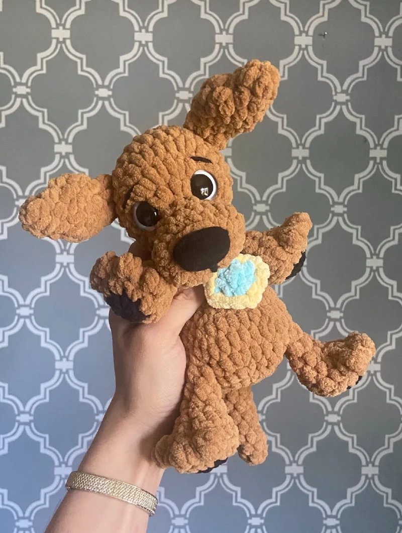 Playful Caramel Plush Dog with Light Blue Flower Medal