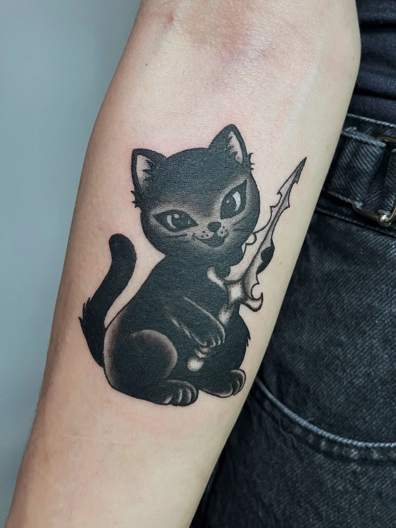 Playful Dark Kitten Holding a Fantasy Dagger