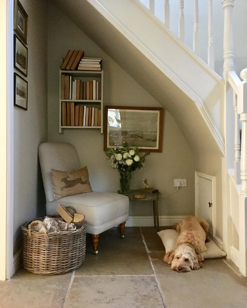 Reading Nook Under-Stairs Alcove with Armchair and Simple Fabric Pet Mat