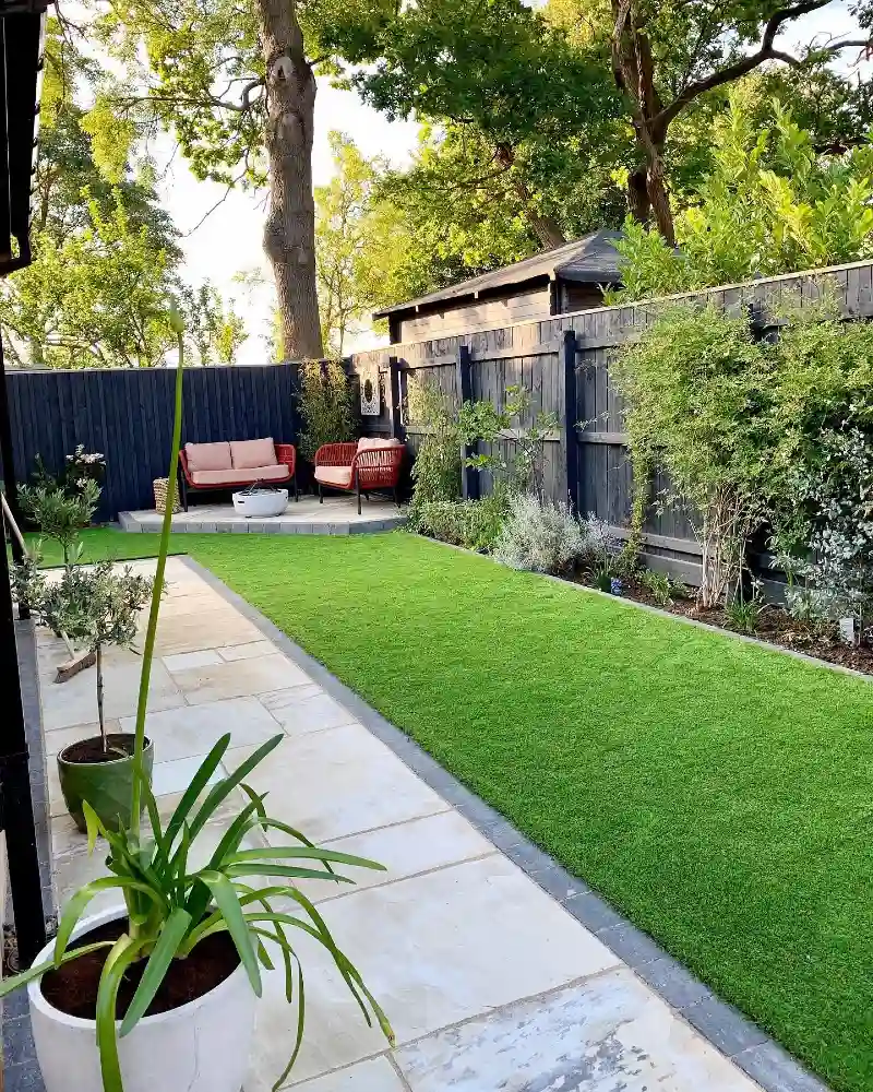 Sandstone Flagstone Path with Manicured Turf and Charcoal Privacy Fence
