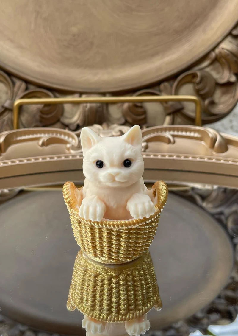 Sculpted Cream Kitten Figurine in Woven Gold Basket