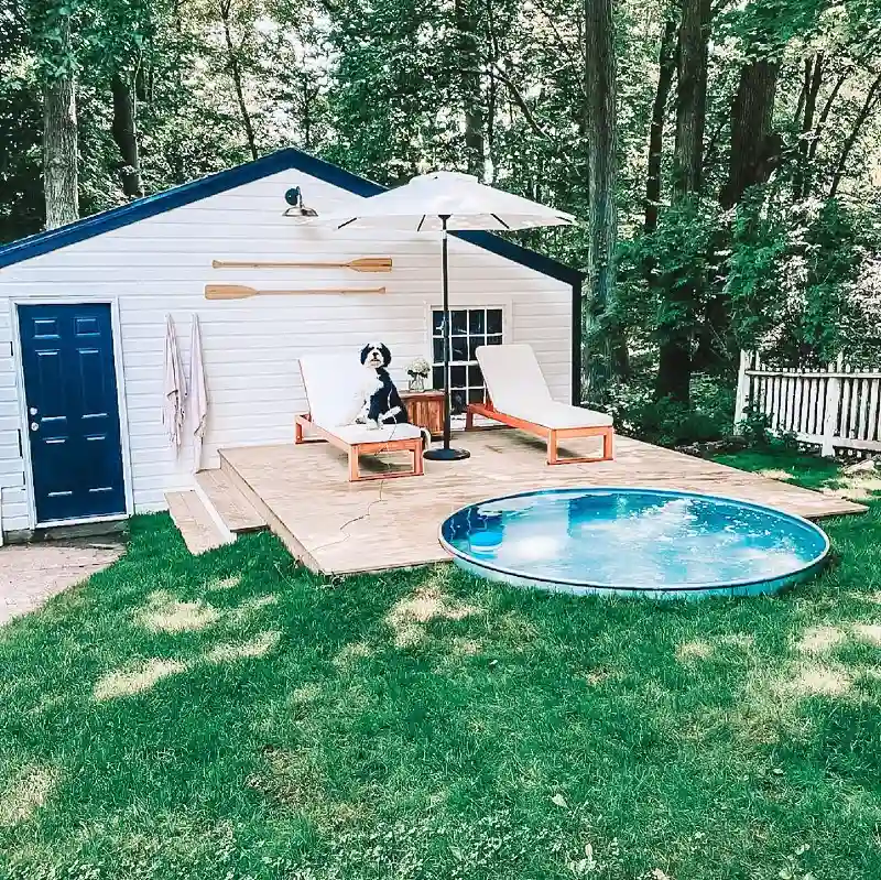 Semi-In-Ground Stock Tank Pool with a Custom Timber Sun Deck