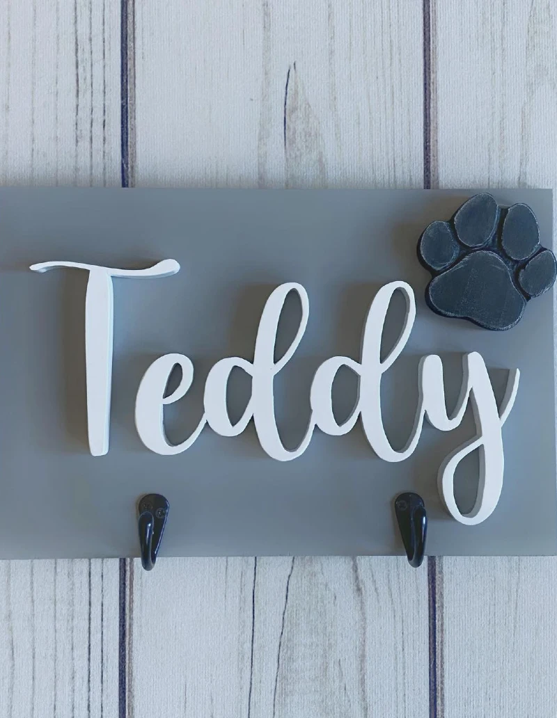 Slate Gray Wooden Plaque with White Script Lettering and Black Paw Detail