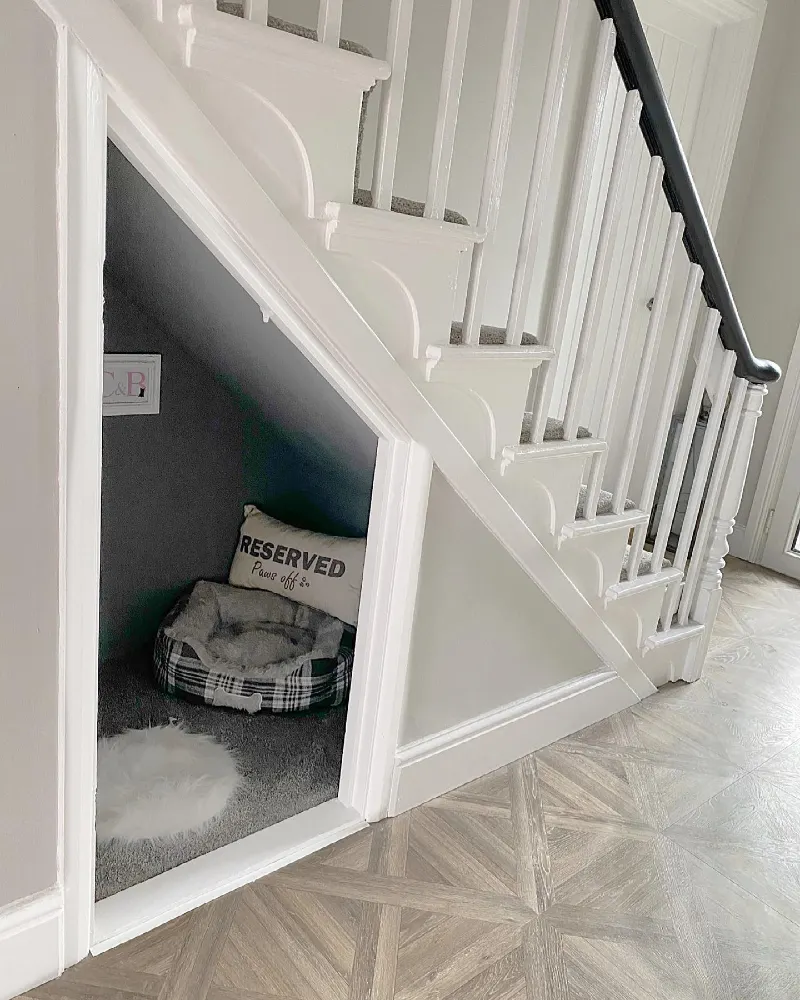 Sloping White Trim Nook with Plaid Pet Bed and Faux Fur Accent Rug