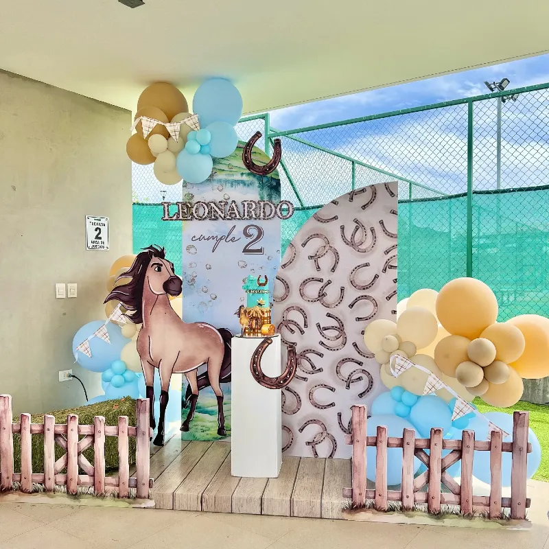 Spirit-Themed Birthday Backdrop with Miniature Picket Fences and Horseshoe Pattern Panel