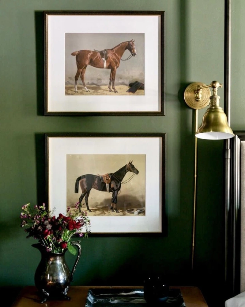 Stacked Equestrian Profile Prints with Wide Mats on a Deep Forest Green Wall